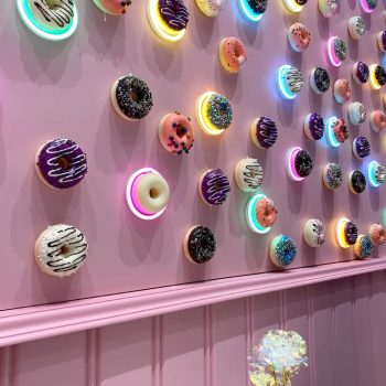This picture shows a wall of donuts